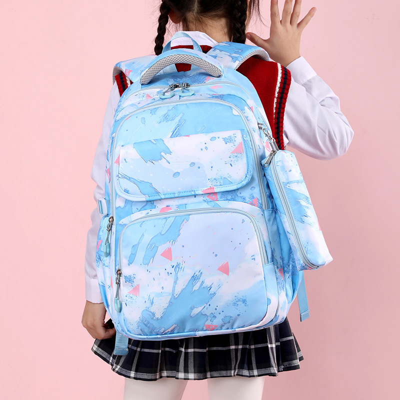 Transfronterizo de tres piezas mochila ultraligero reducción de carga grado 3-6 escuela primaria estudiante mochila niños escuela primaria mochila al por mayor