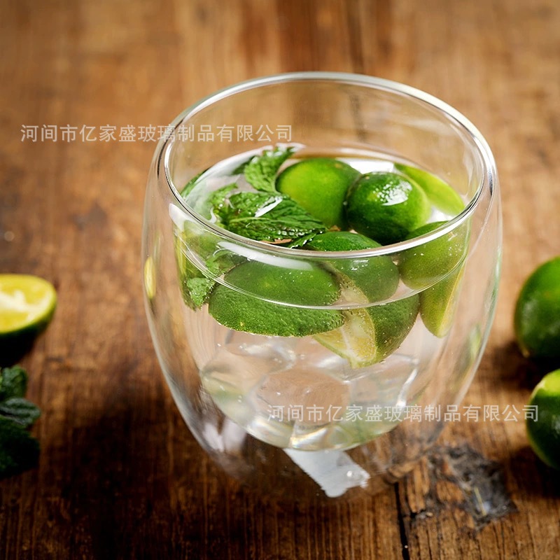 Taza de doble capa en forma de huevo al por mayor de fábrica Taza de vidrio aislante de doble capa Taza de café con leche de jugo simple Taza de vidrio para el hogar