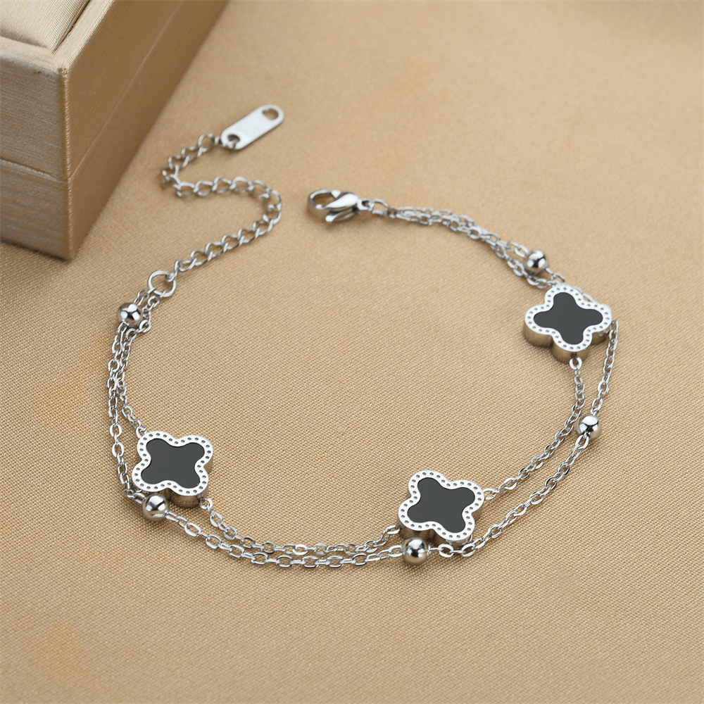 Ventas transfronterizas calientes de acero de titanio negro y blanco pulsera de cuatro hojas de doble capa de cadena de bola de acero oro rosa nicho de alta calidad joyas de pulsera