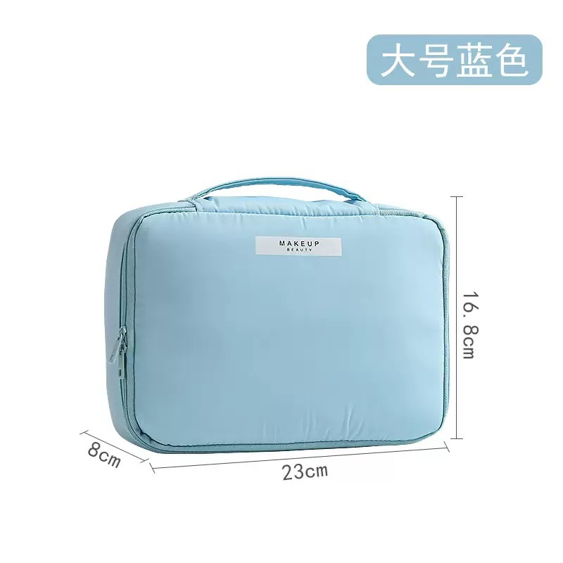 Capacious handheld cosmetic bag