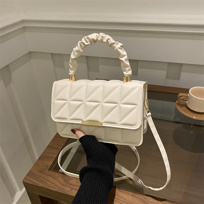 Minimalista bolso de viaje de viento 2024 engolpeado diamante otoño nuevo diseño de bolso de hombro simple estilo bolso de mochila