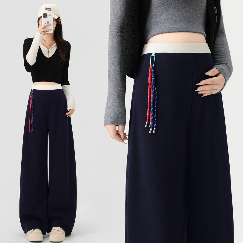 Maternity pants for spring and autumn, high-waisted, loose-fitting, slimming, with a flowing drape, wide-leg design, and a contrasting color scheme, creating a stylish and casual look