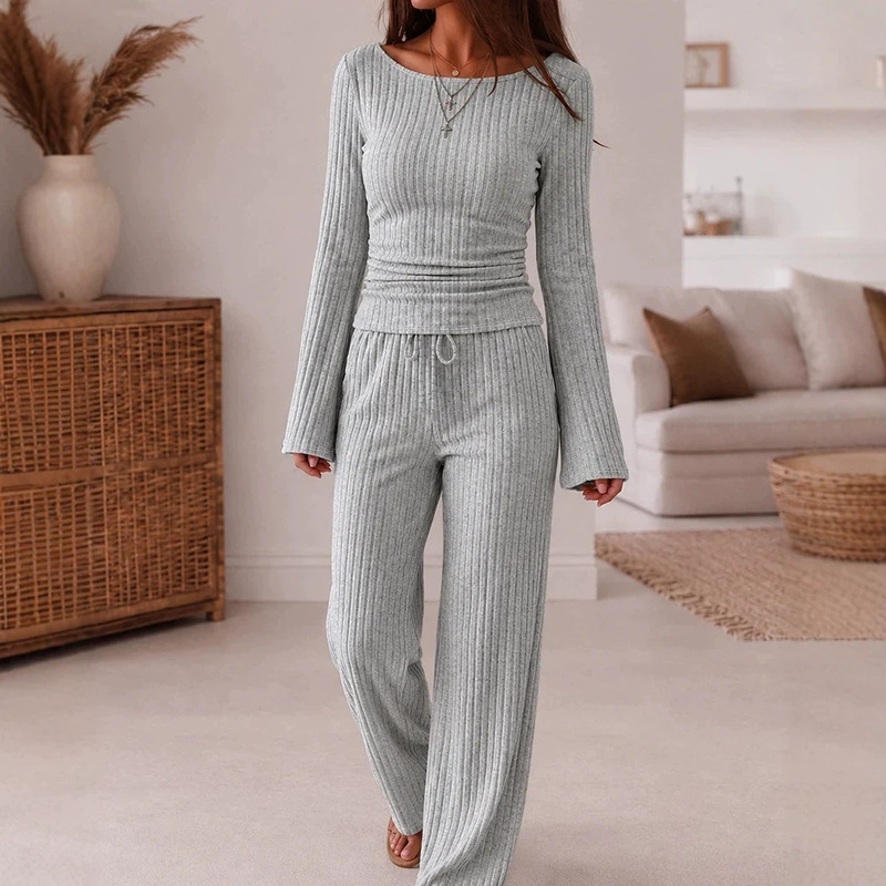 Women's two-piece ribbed knit loungewear set featuring a scoop-neck, flared-sleeve, ruched top and wide-leg pants Women's two-piece ribbed knit loungewear set featuring a scoop-neck, flared-sleeve, ruched top and wide-leg pants
