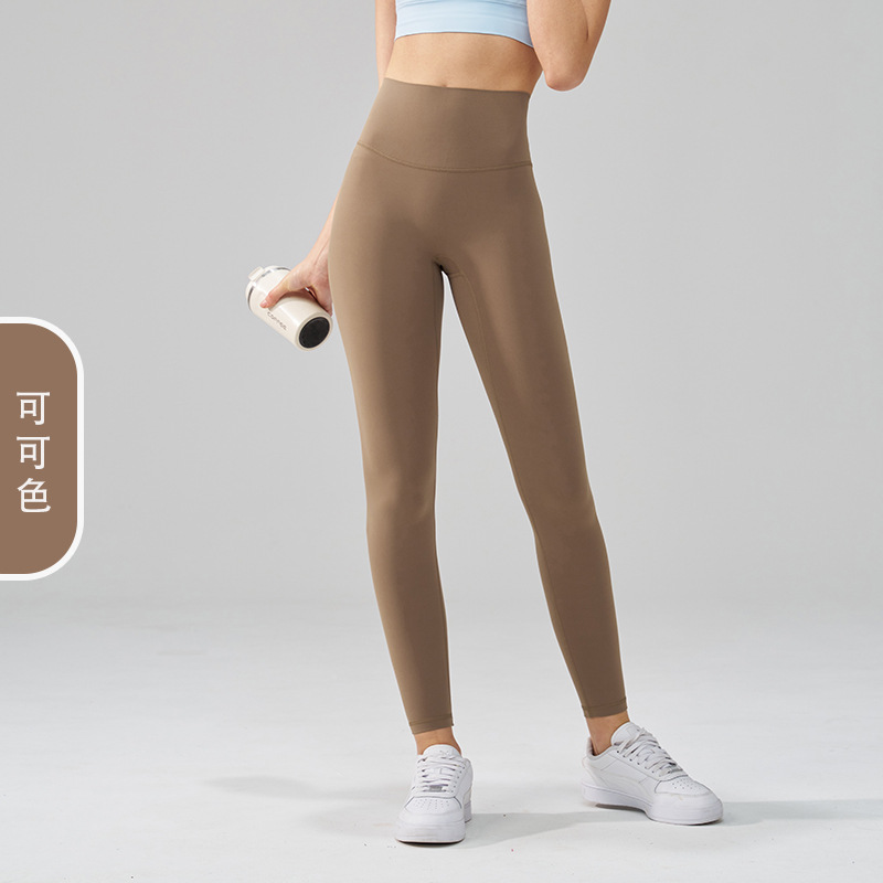 ヨガのズボンの女性のもとの工場の両面は毛のズボンを磨いて外にスポーツのズボンを着ます。