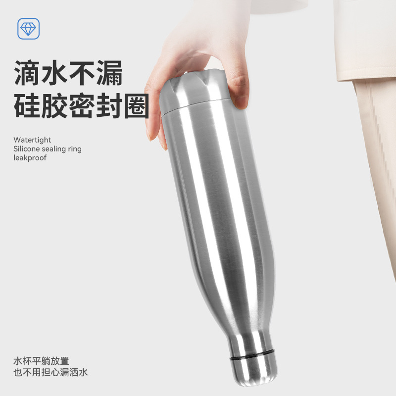 Botella de cocaque de acero inoxidable Amazon 304 con manija Taza de vacío de doble capa Botella deportiva de bala portátil