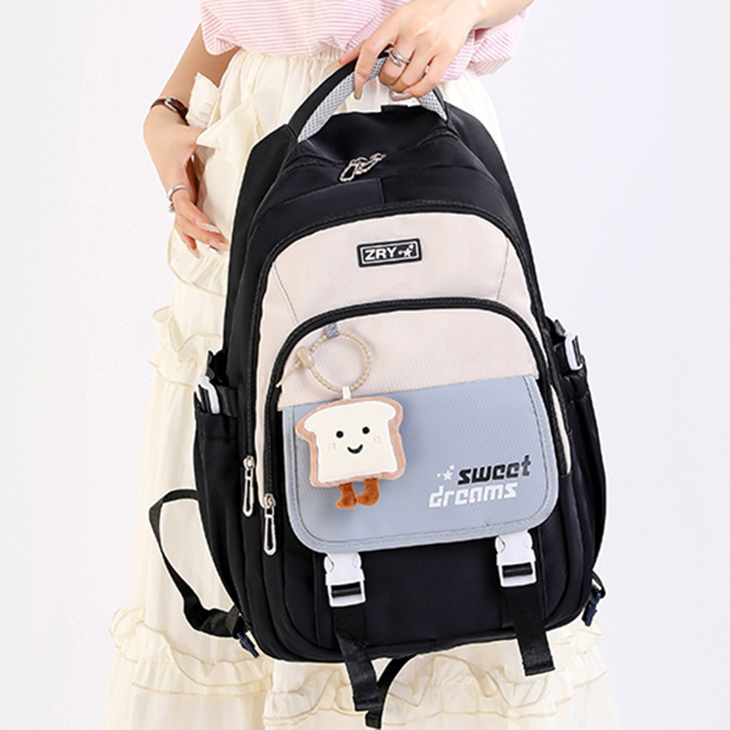 New Breathable, Lightweight, Spine-Protecting, High-Looking, Large-Capacity Backpack for Boys and Girls, Junior High School Students in Grades Three to Six