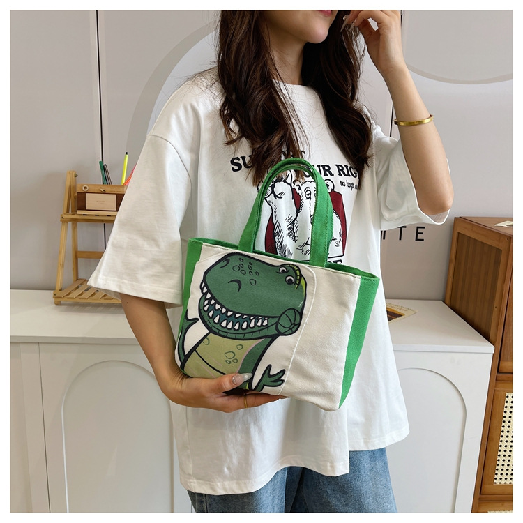 Cute cartoon printed small bag, 2024 summer new style hand-held piggy girl handbag, student storage canvas bag undefined