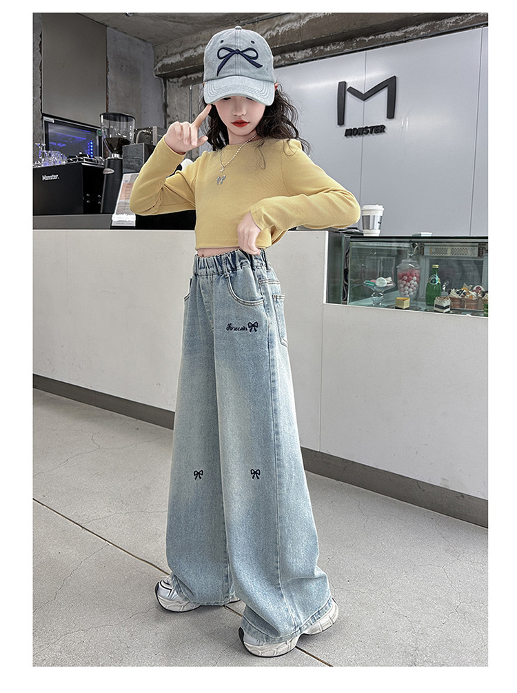 女の子の大きい子供のジーパンの春秋は2025新型の韓国版の洋風のカジュアルな広い足のズボンの女の子の春の金のゆったりしているズボンを詰めます。