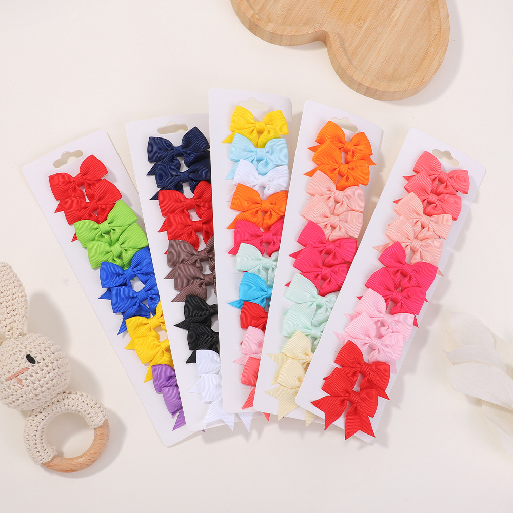Juego de horquillas con lazo de cola de milano para niños de estilo caliente de Amazon, lindo y versátil, horquilla diaria para niñas europeas y americanas 323