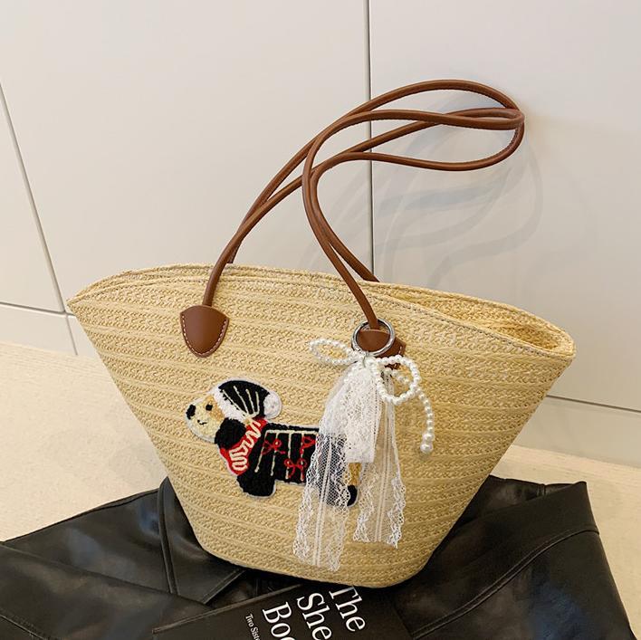 Venta caliente de verano bolso tejido caliente femenino 2025 nuevo bolso de cubo de playa de vacaciones bolso de paja de gran capacidad