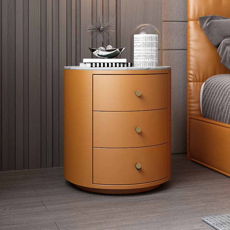 흰색 슬레이트가 있는 주황색 3단 서랍 원형 캐비닛