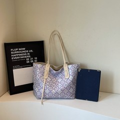 オリジナルの高級感のあるバッグの女性2025プリントの金の爆発的なバッグのファッションに合わせて通勤している女性バッグのバッグ
