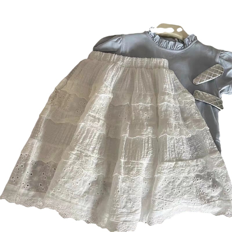 Estrella infantil coreana nueva primavera y verano ropa de niñas niños encaje hueco falda de busto falda de aire al por mayor de la moda