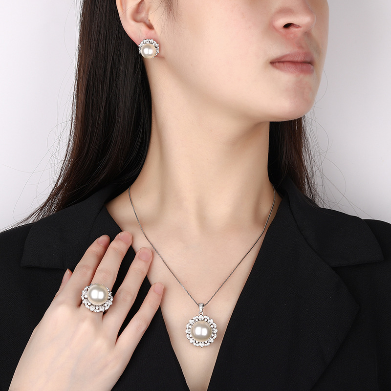 Nuevo Zhuang Shengsheng Jewelry Fondo de cobre chapado en oro simulación perla blanca perla moda juego redondo 16-12mm