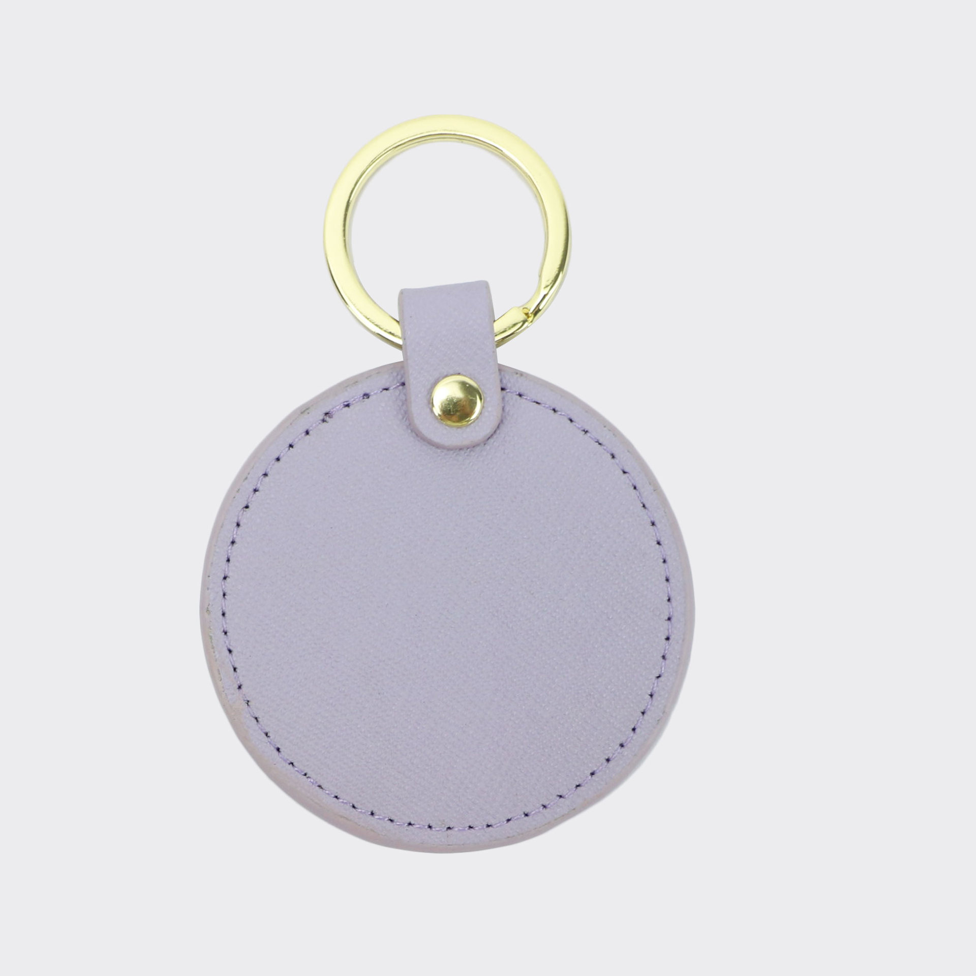 Llavero redondo de cuero genuino personalizado creativo simple colgante hombres y mujeres pequeño exquisito pequeño regalo al por mayor todo a juego