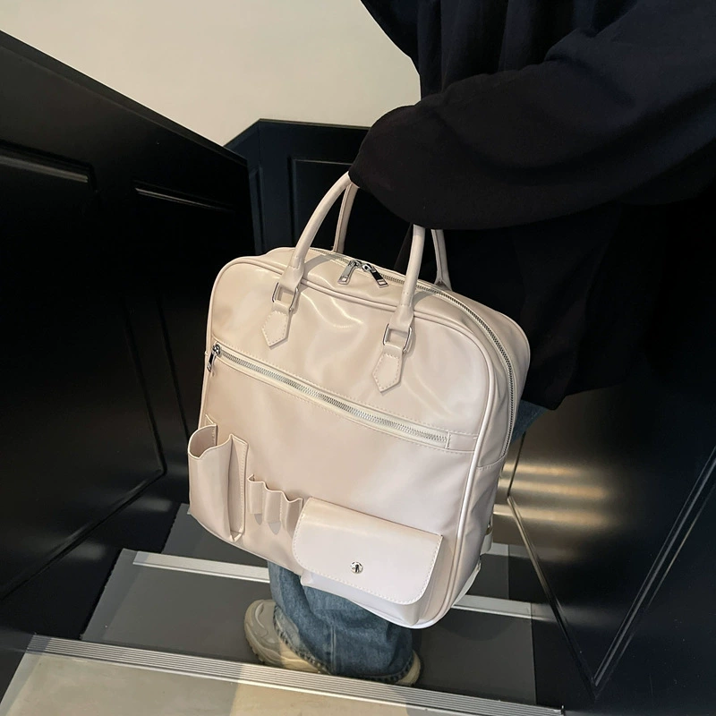 Capacious backpack, handheld bag, trend of season
