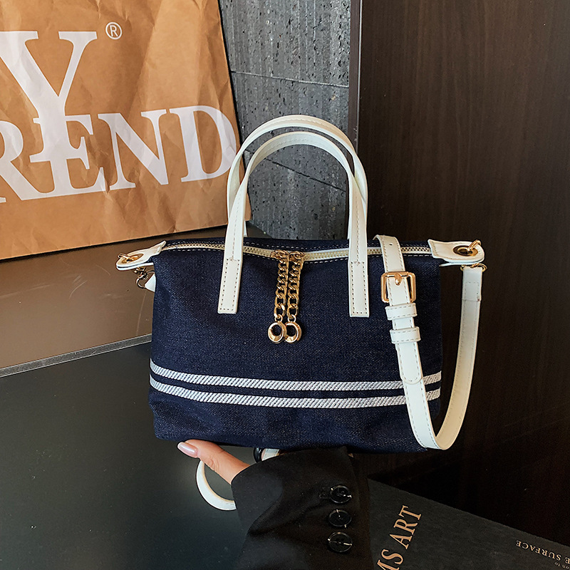Tela estriada bolso de bolsillo de mano mujer 2026 venta caliente nuevo estilo de alta calidad sensación de moda versátil bolso de hombro