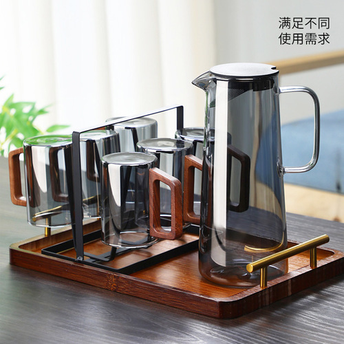 Cross-border wooden-handle glass tea cups, heat-resistant living room cups, and home-use hospitality water set—including a kettle and matching water glasses.
