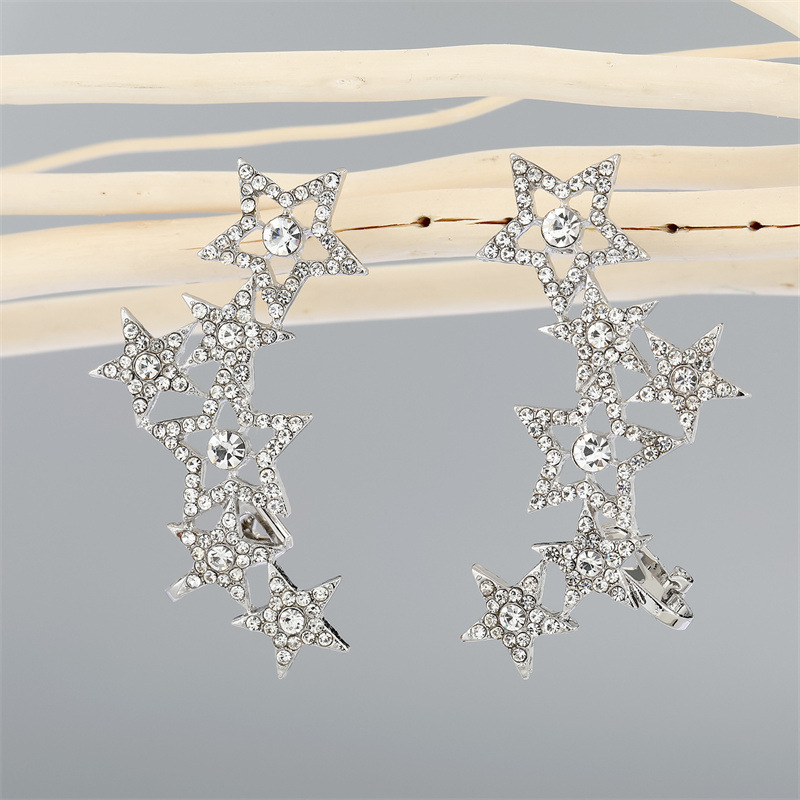 Retro Hollow Rhinestone Five-pointed Star Long Earrings display picture 5