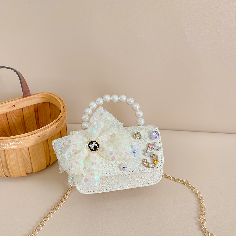 Primavera y verano nueva celebridad en línea bolso de los niños moda Chanel estilo princesa bolsa pequeña niña linda bolsa de mensajero portátil al por mayor