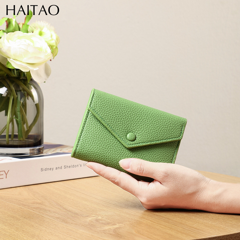 Cartera de mujer corta simple cartera plegable de tres pliegues japonesa y coreana de moda nuevo sobre bolso de cambio transfronterizo