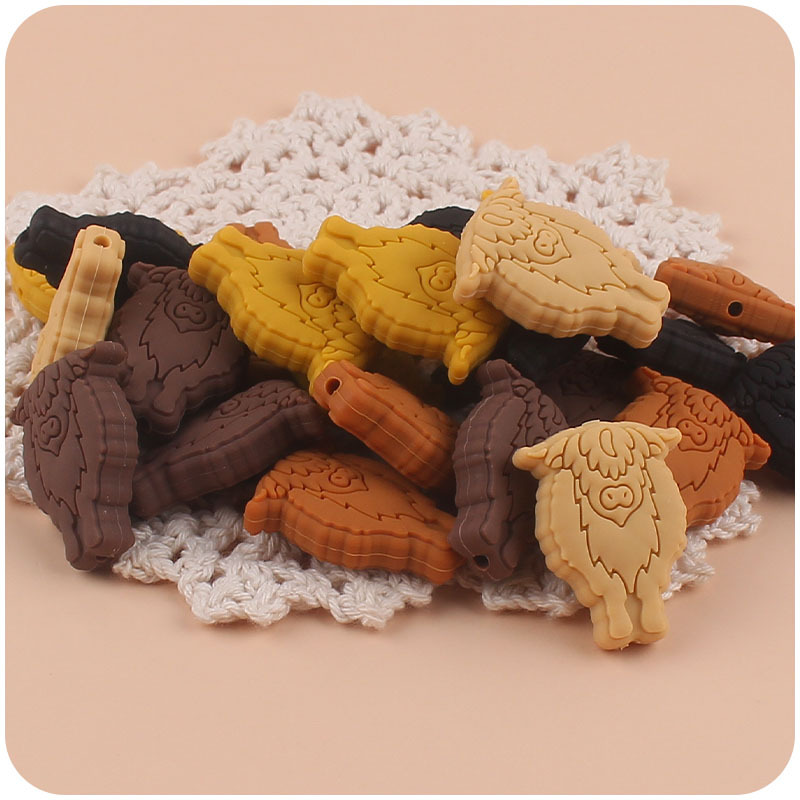 Nuevo bebé suministros de dibujos animados vaca pequeño mordedor creativo DIY bebé molar Cadena de pezón cadena anti-gota accesorios pequeños