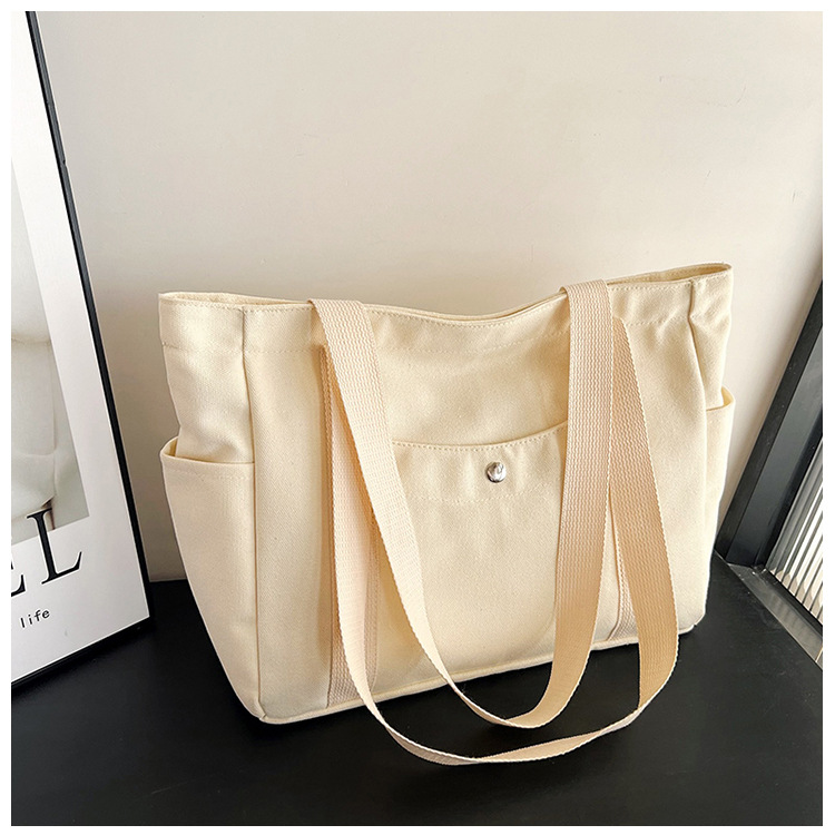 Wholesale of new women's single-shoulder bags, cross-border simple and casual canvas bags, Korean version LOGO printed commuter tote bags undefined