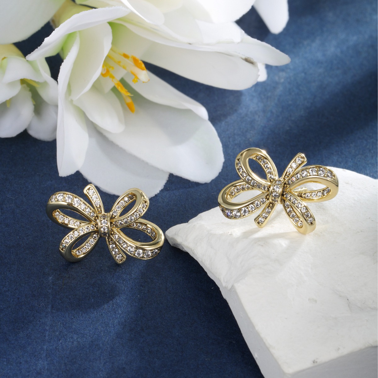 Joyería Xuping arco de bronce de piedra arco pernos de orejas de lujo nicho ligero japonés y coreano aretes dulces mujeres