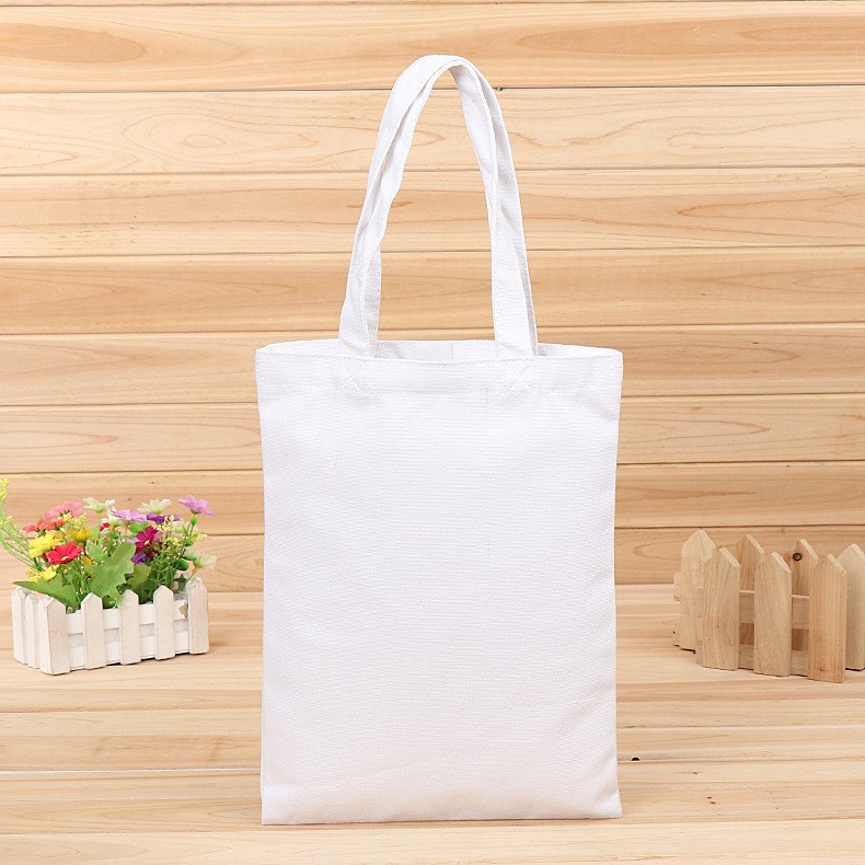 En stock bolsa de lona portátil en blanco personalizable logotipo de impresión en color de un solo hombro bolsa de compras bolsa de algodón de entrenamiento publicitario