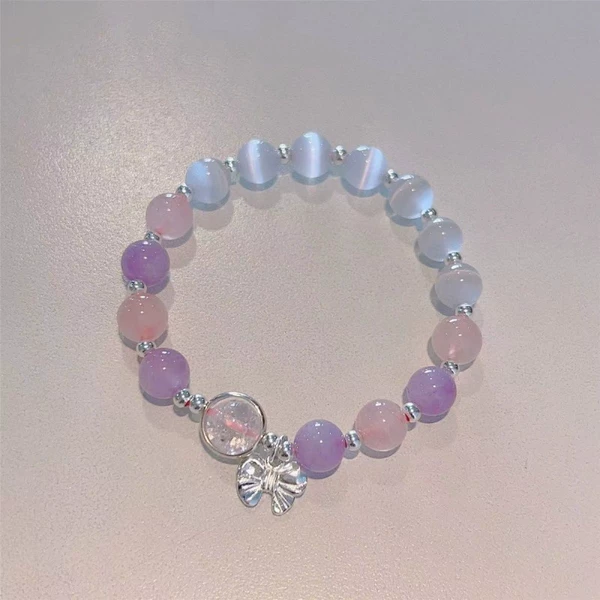 Purple bracelet with bow, cat's eye