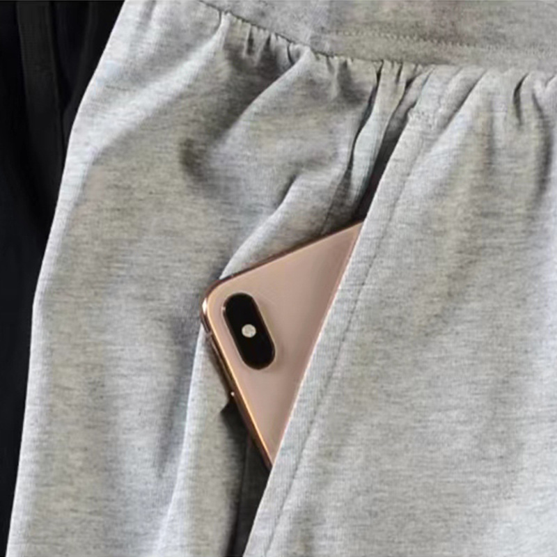 Pantalones cortos masculinos de Nueva tendencia, pantalones cortos casuales de moda, pantalones de algodón de cintura media, pantalones de cintura media de color sólido, impresión al por mayor de la fábrica de pantalones juveniles micro - bomba