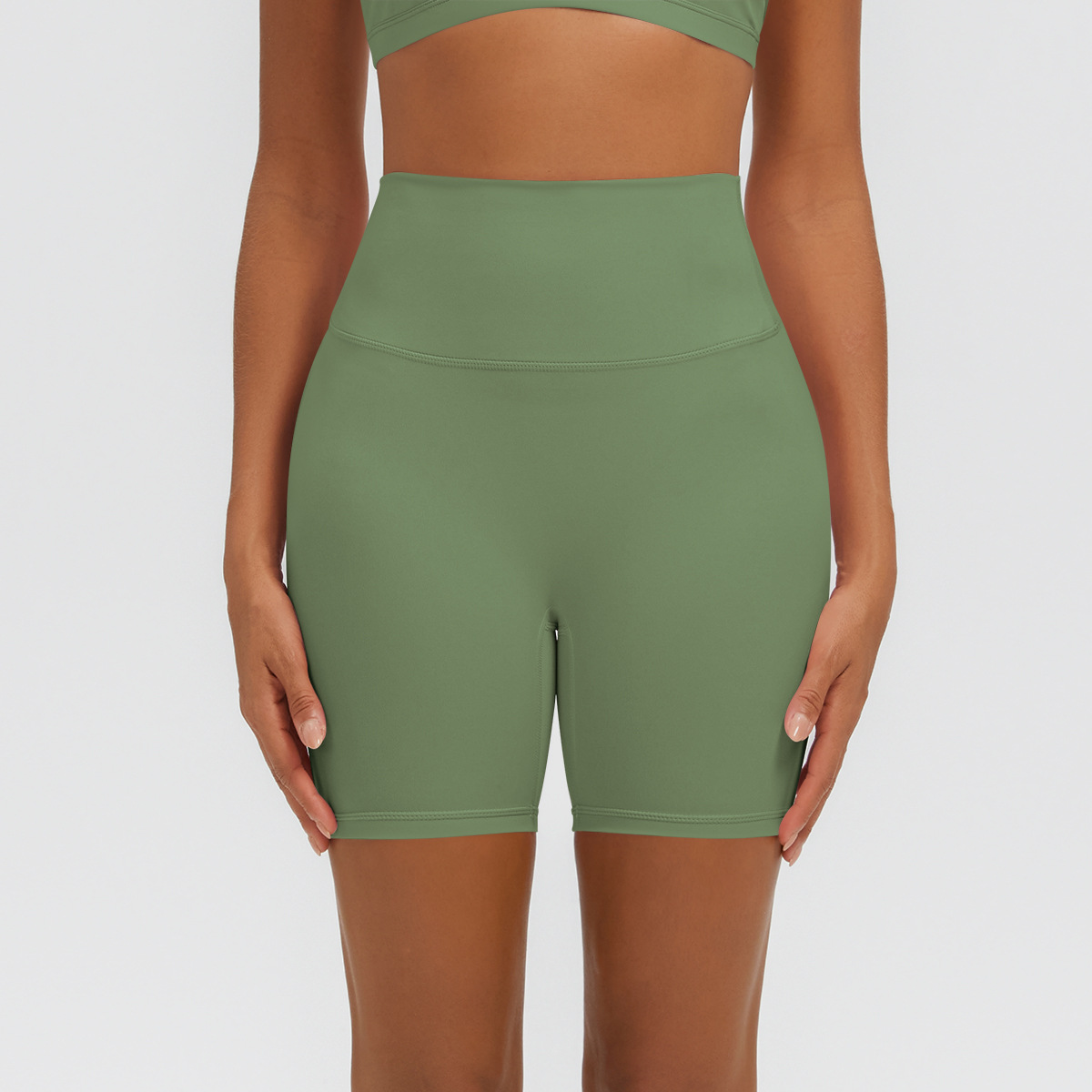 Nuevo tipo delgado de hielo, piel transpirable, ajustado, color sólido, ropa de yoga, pantalones cortos de tres puntos.