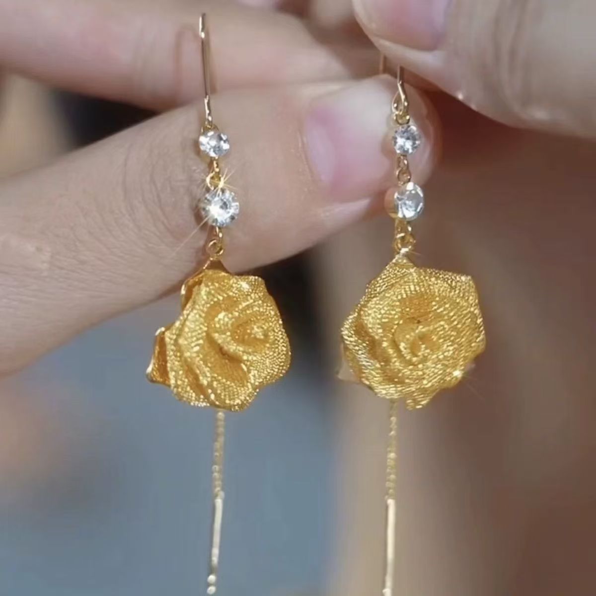 Golden fashionable elegant small design earrings with tassels