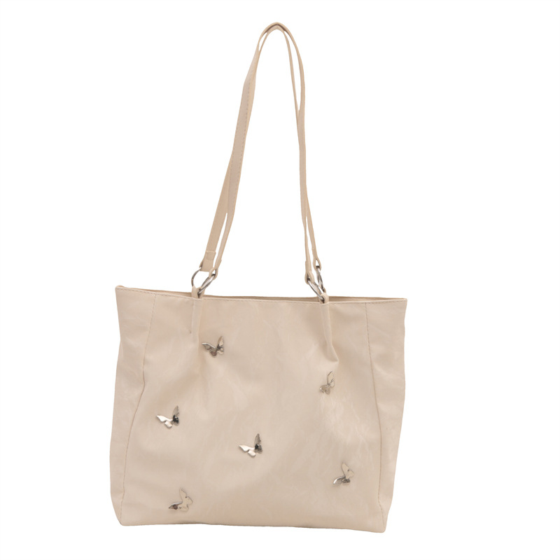 Bolsos de cubo de arco de alta calidad para mujeres 2024 verano nuevo estilo extranjero nicho bolso de hombro de moda bolso de mujer