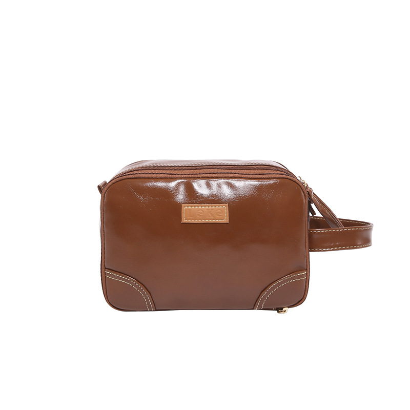 2025 nuevo paquete de lavado multicapa de gran capacidad, bolsas de maquillaje comerciales simples, bolsas de almacenamiento multifuncionales para viajes de cuero pu