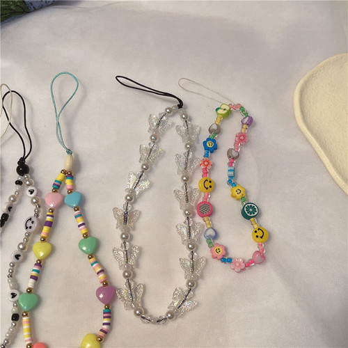 New Korean version ins creative bohemian soft clay smiling face pearl beaded butterfly mobile phone lanyard mobile phone chain for women