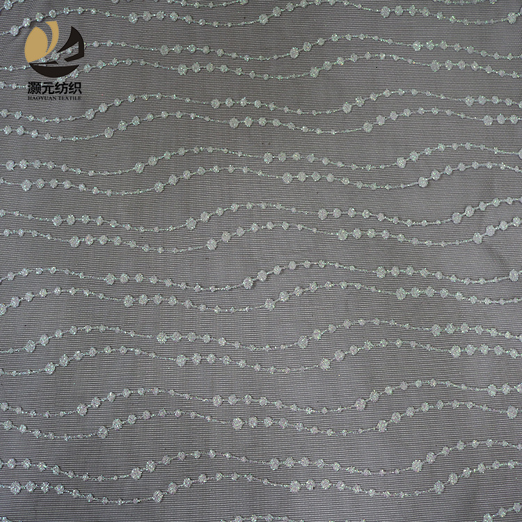 Fabricantes de venta de bajo precio ondulado fantasía polvo brillante tela de malla vestido de noche tela de boda