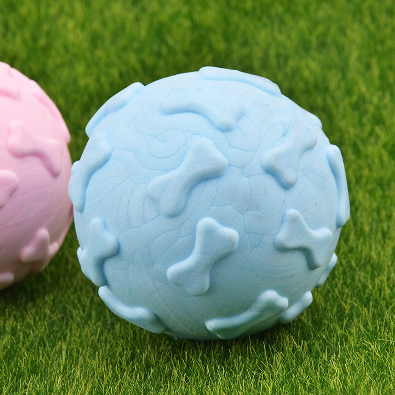 Juguete para mascotas transfronterizo TPR Bola de hueso de espuma mordedura molar sabor a leche bola sólida fábrica de juguetes para perros