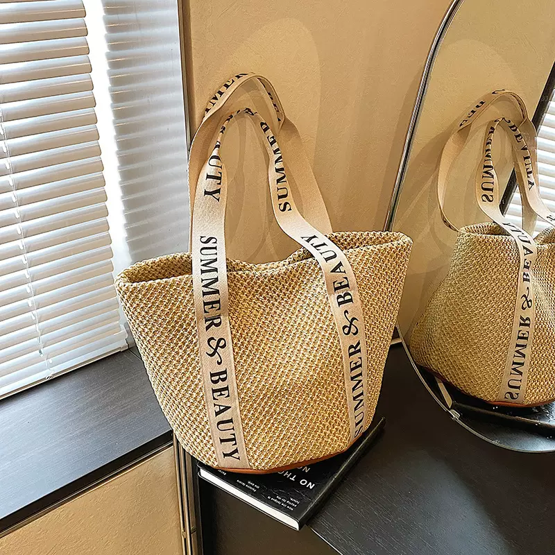 编织草编包包女大容量2025新款春夏百搭单肩海边沙滩包通勤水桶包