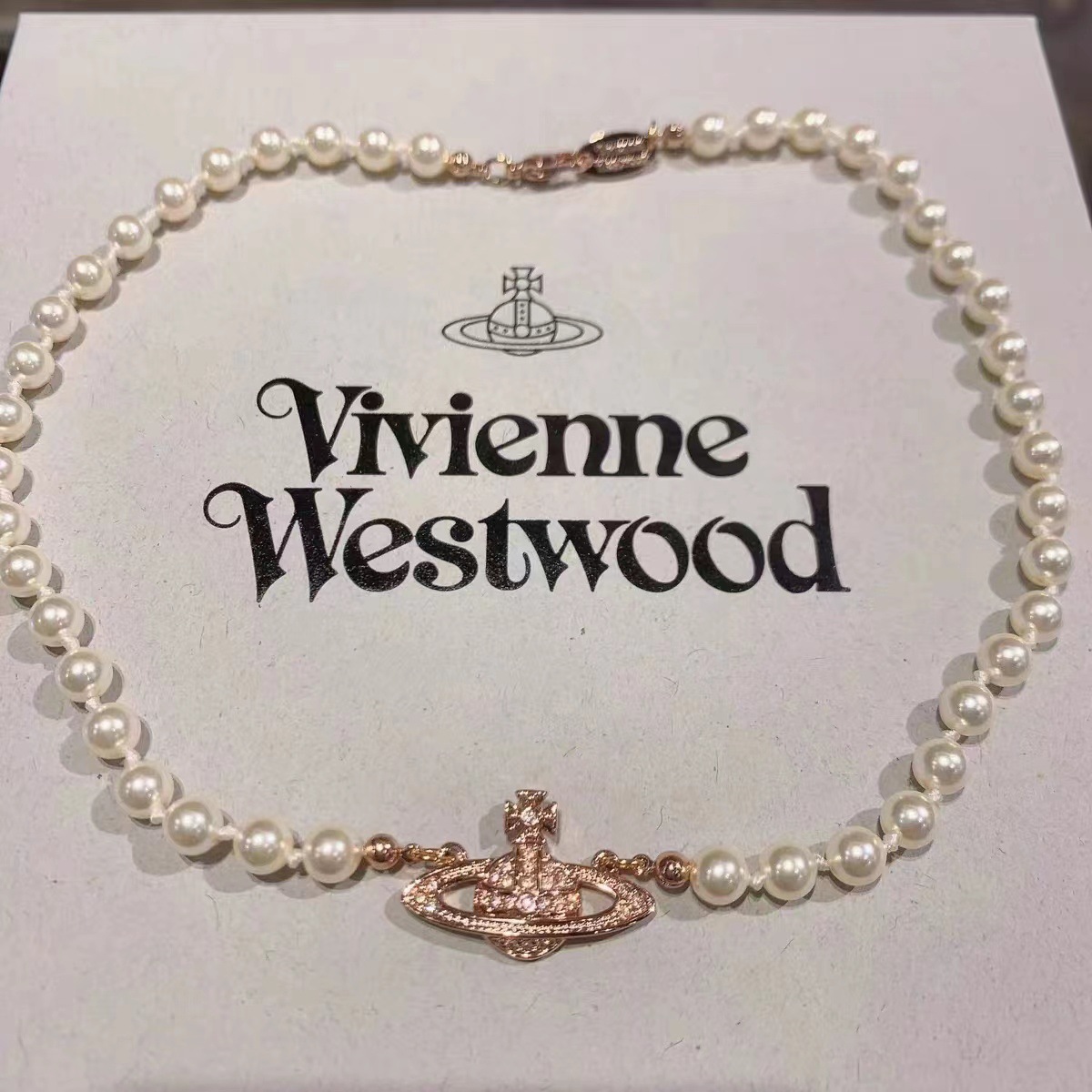 Saturn necklace rose gold