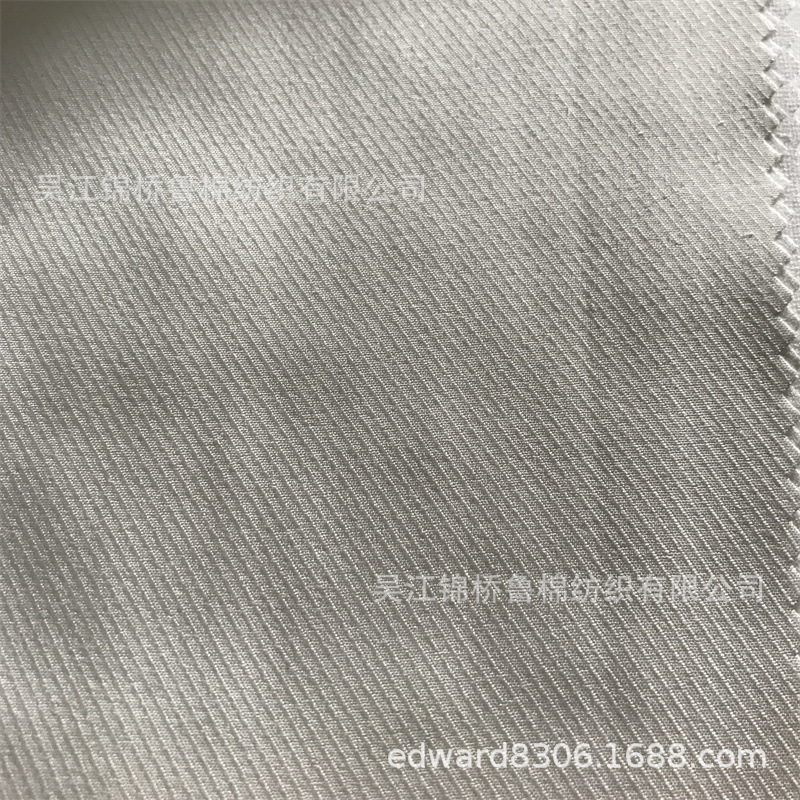锦棉骑兵斜70D*21S 133*86变化双面斜蜂巢提花布磨毛环保PA涂层