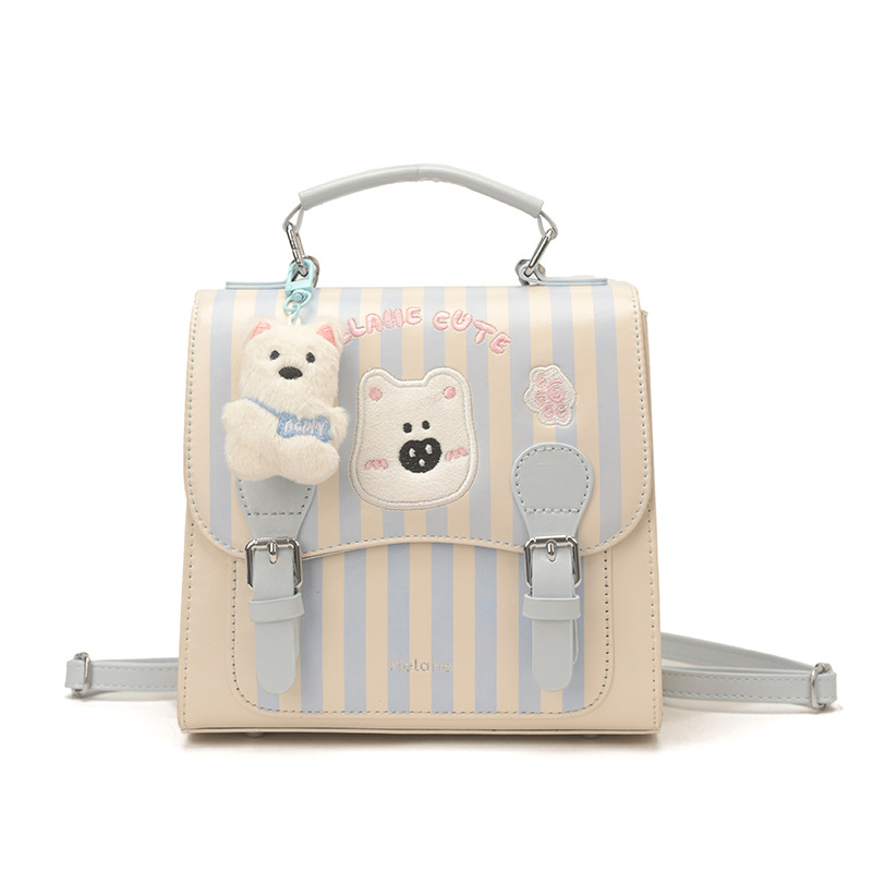 Caricatura encantadora oso, mochila para niños y niñas, mochila para niños a rayas extranjeras, nueva mochila coreana para padres e hijos.