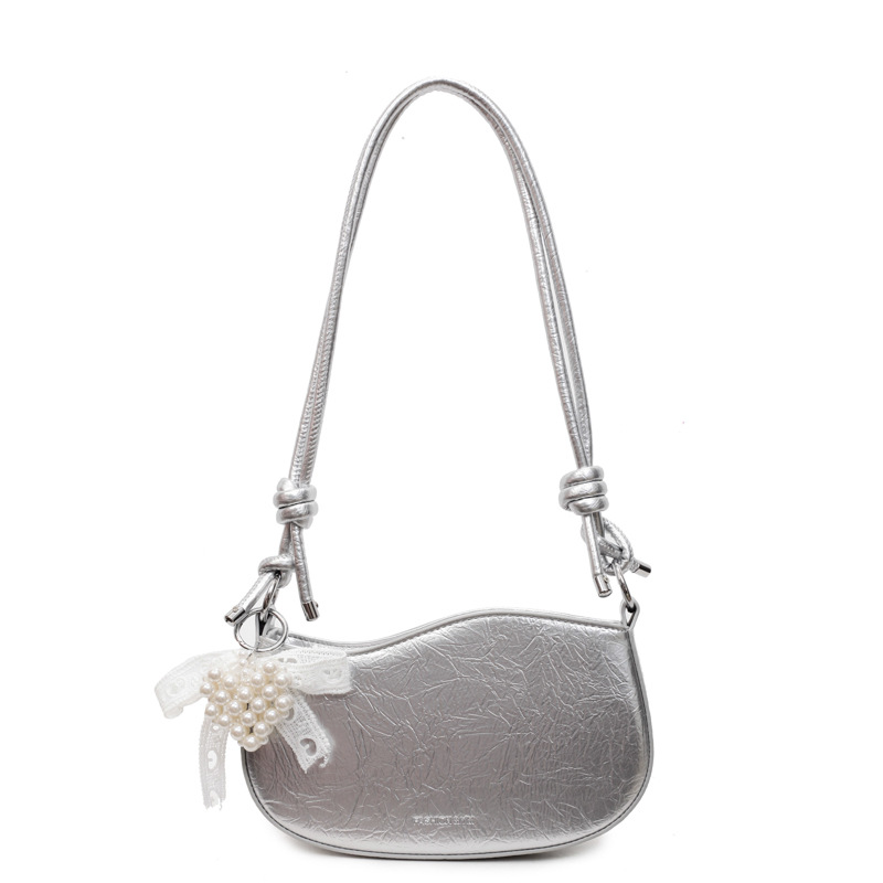 Bolsos pequeños de alta calidad 2025 verano nuevo estilo bolso femenino diseño de nicho bolso de hombro moda patrón de agarre de mano bolso de mensajero