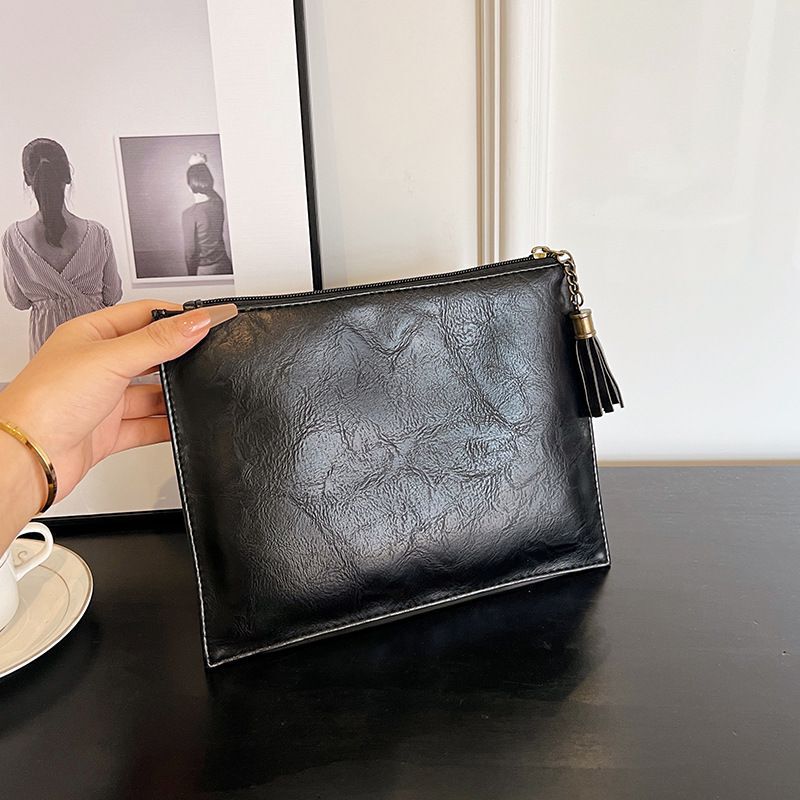 New retro solid color tassel cosmetic bag portable high-texture clutch daily high-grade portable zipper soft bag New retro solid color tassel cosmetic bag portable high-texture clutch daily high-grade portable zipper soft bag