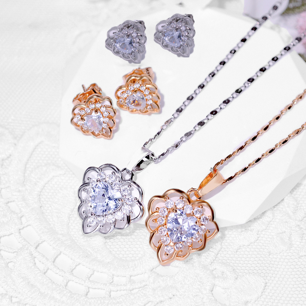 2024 nuevo aretes de moda collar conjunto de joyería mujer transfronteriza diseño popular pendientes colgante dos juegos de joyería