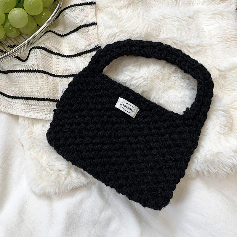 Bolsa de mano de damas de otoño y invierno 2025 nuevo estilo simple ganchillo a mano lana tejido bolsas de hombro al por mayor