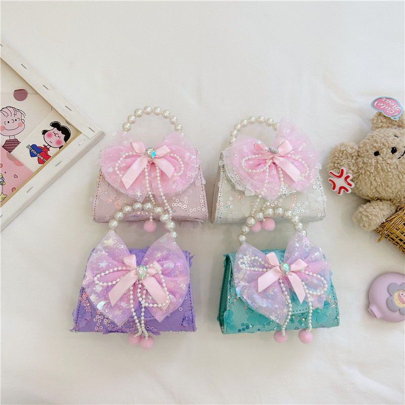 Nueva princesa de dibujos animados bolsos infantiles lindos bolsos de arco de moda chica perla bolsos de hombro