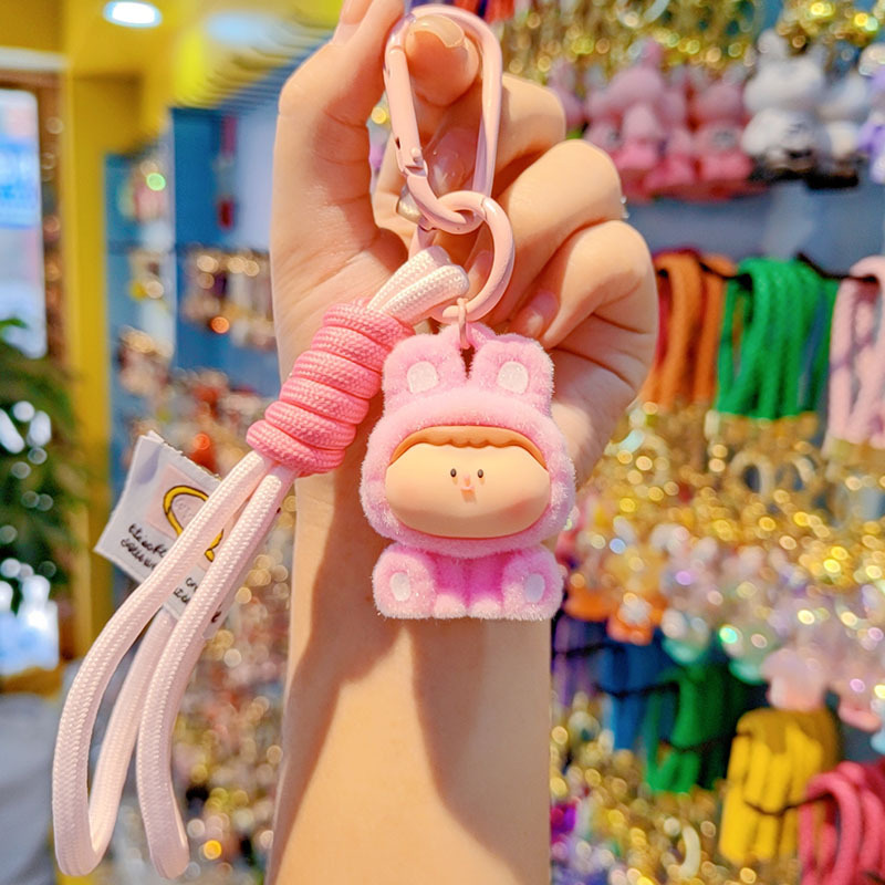 Caricatura floc amarelis llavero de automóvil pareja colgante bolsos creativos colgar garra máquina regalos al por mayor