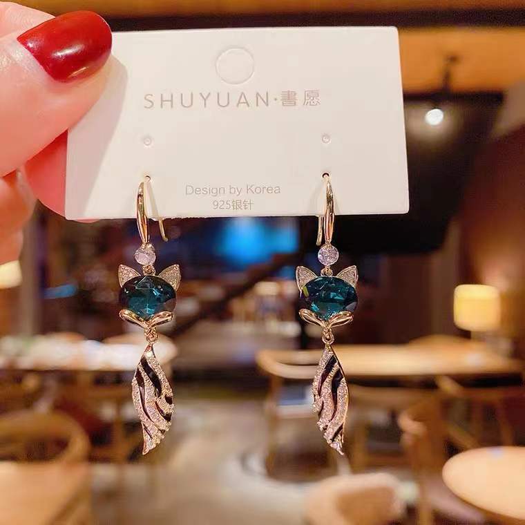 Blue design elegant earrings with rhinestones with tassels