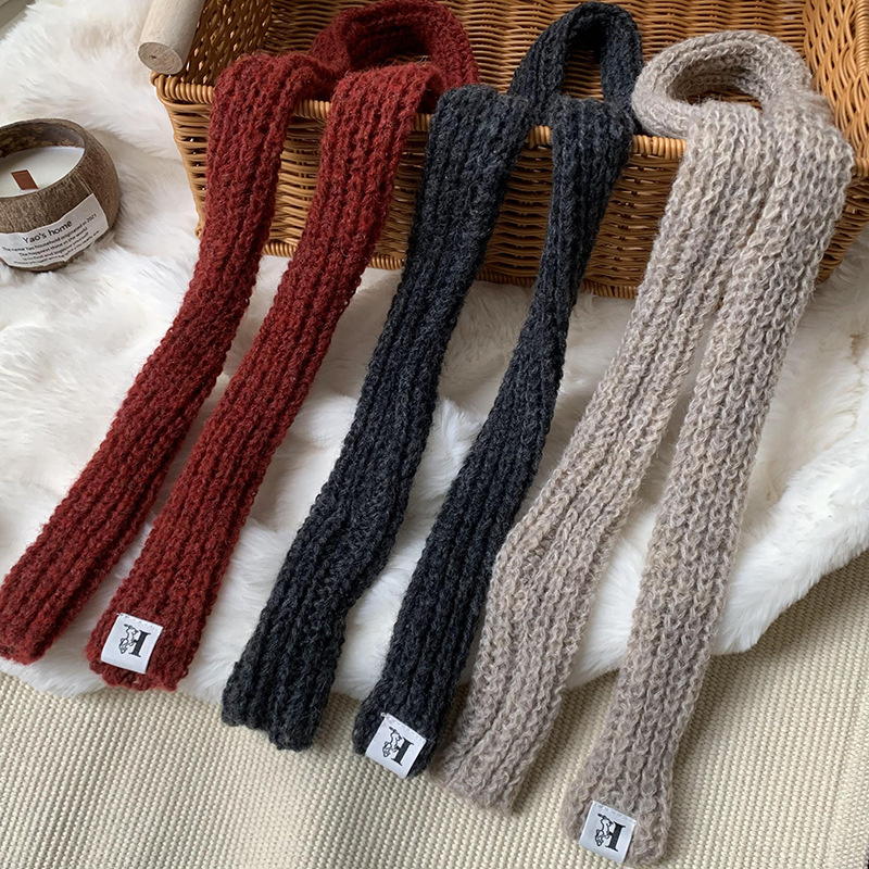 Otoño y invierno bufandas mujeres 2025 nuevo color sólido caliente de protección de cuello de lana de punto largo bufandas al por mayor